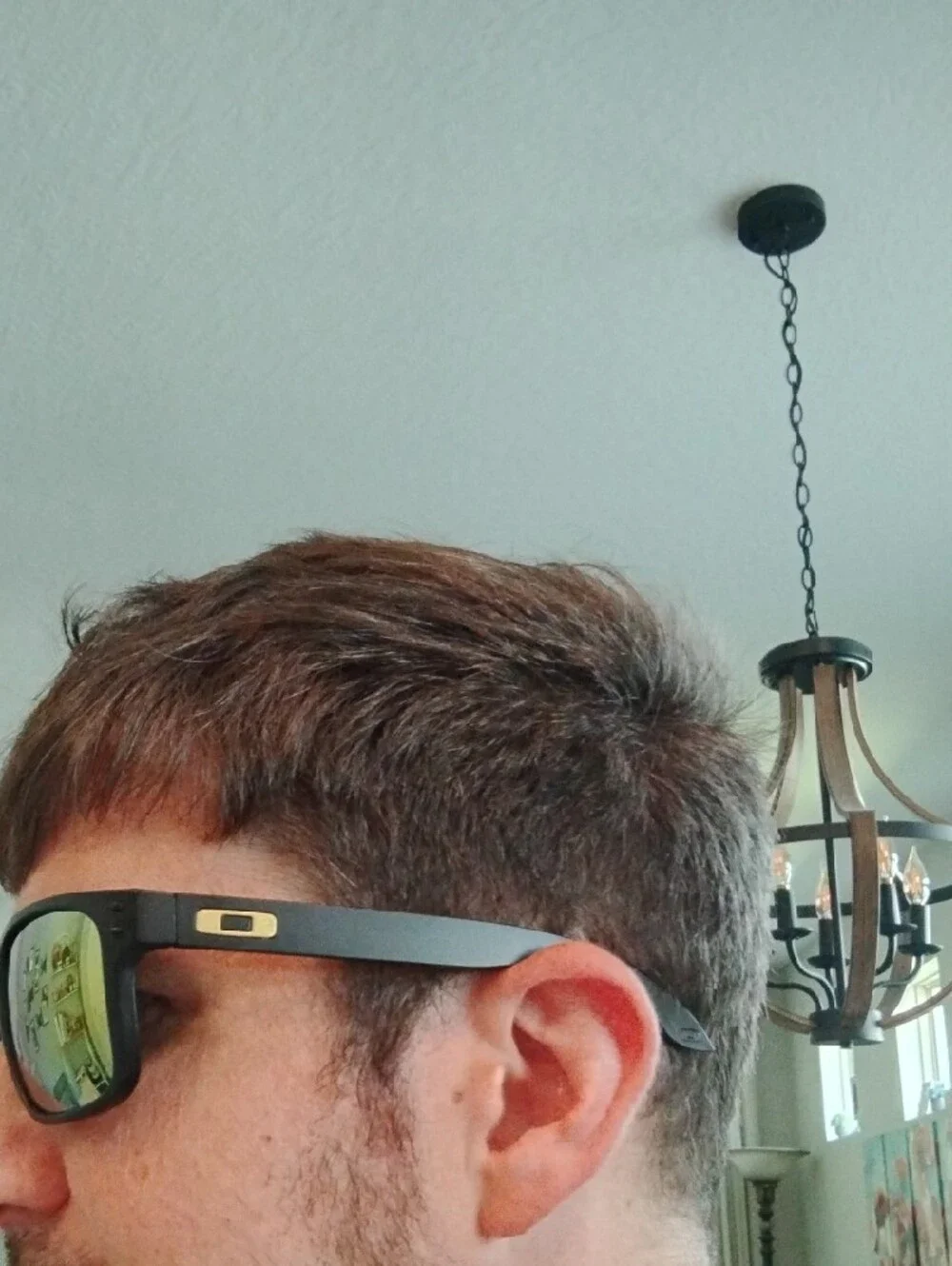 Oakley Matte Black Sunglasses with Yellow-Orange Mirror Lenses